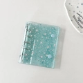 Détail du classeur à étoiles laser vert menthe avec texture PVC et anneaux en métal argent - Sans Pages Intérieures / Étoile bleue