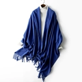 Elegant solid blue long knit scarf with fringe tassels shown on a white turtleneck - Royal Blue