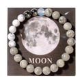 Detailed top view of the universe planet bracelet on a decorative moon theme card - Moon (With Card)