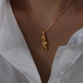 Exaggerated golden seahorse pendant necklace on a white shirt model closeup - Seahorse-41+5cm