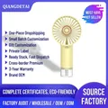 Portable handheld misting fan in lemon yellow with transparent base and humidifier - Handheld Misting Fan / Yellow / 1200mAh