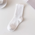 White cotton slouch socks with ruffled edges and ribbed texture for a cozy look - One Size / White