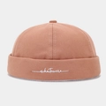 Detailed view of terracotta docker hat featuring white whatever script embroidery. - Adjustable / Dusty Pink