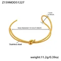 Detail view of gold stainless steel knot bangle with size measurements and weight info - One Size / Knot Decor Double Line Style (Z159) / Gold