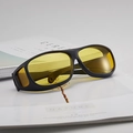 Professional night vision cycling glasses with yellow lenses on a minimalist background - Black Frame Yellow Lens (Polarized)
