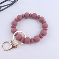 Detail of dusty rose silicone bead wristlet keychain with gold metal ring and lobster clasp - Dark Mauve