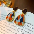 Vintage gold stud earrings featuring orange and blue fabric inlay on old book background - 121 Silver Pin-Triangle Rhombus
