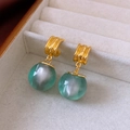 Detailed shot of green resin drop earrings with gold-toned metal on white velvet - 25# Silver Needle - Gold - Green