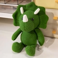 Handmade crochet triceratops plush toy in deep green yarn for nursery decor - 25cm Triceratops