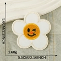 Cartoon flower embroidery patch with wink face design and yellow center 5.6cm - Smiling Flower White