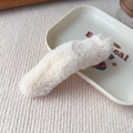 Detailed texture of creamy white plush hair clip made of soft artificial faux fur material - Basic Style / Off White