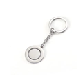 Close-up of polished silver stainless steel rotating disk pendant keychain on white background - Keychain / Steel Color Keychain