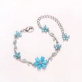 Silver-finish floral bracelet with light blue crystal flower petals and lobster clasp - Turquoise-White Gold