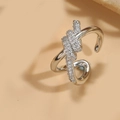 Macro shot of a silver knotted open ring with shimmering clear cubic zirconia stones - Twisted Knot Style (JZ0428缠绕型)