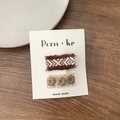Set of two fabric hair clips featuring dark red woven fringe and beige floral accents - Square 2-Piece Set