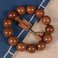 Macro shot of natural Phoebe zhennan wood beads with golden silk texture and carved tag - Square Tag + Accessories / 18mm*13 Beads