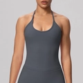 Detail of dark grey halter yoga top featuring a high-elastic matte finish and slim fit design - S / Tops / Graphite Grey