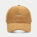 Detailed view of white 'whatever' script embroidery on a camel faux suede baseball cap - Adjustable / Camel