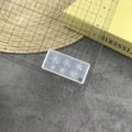 Macro view of transparent silicone flower mold for nail art with size measurement ruler - #179 Peach Blossom