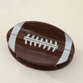 Close-up of brown rugby-shaped hair claw clip with glossy finish and white stitch details - Rugby Ball