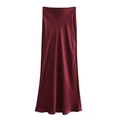 Detail of dark red satin maxi skirt showing glossy texture and elegant drape - Burgundy