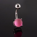 Macro detail of silver-tone belly ring featuring a matte pink resin ball on black surface - 1.6x10x5x8mm / Pink