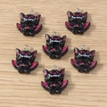 Detailed view of black resin bat charms with pink accents and metal rings for DIY jewelry - Bat