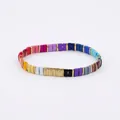 Macro detail of elastic rainbow tile bracelet with colorful enamel beads and gold spacers - Multicolor Splicing