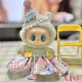 Green plush Labubu doll wearing a pastel patchwork dress and festive party hat - Colorful Cake Hat Set / First And Second Generation Keychains Are Compatible With La Cloth Dolls. Dolls Not Included.