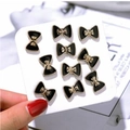 Set of 10 gold and black bow-shaped pearl anti-exposure brooches on display card - Black Gold Bow Series Style