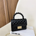 Black jelly PVC handbag with quilted pattern, pearl handle, and golden chain strap - Black