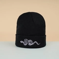 Close-up of snake embroidery detail on a premium black knitted beanie for autumn - Embroidered Snake / Black