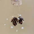 Detail of vintage leopard resin petals with white pearls and gold tassel ear hooks - Ear Hook - Gold - Brown