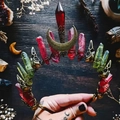 Handmade red and green crystal moon crown headband with skull detail on wooden desk - Red Green Crystal Bronze Skull Moon