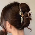 Matte brown shark hair claw clip featuring a cartoon dog ornament on hair for women - Cute Dog IP Style Claw