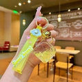Luminous cat paw keychain with yellow stars, sweet heart strap and blue flower charm - Yellow Luminous Bubble Dice