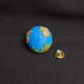 Cute cartoon earth planet enamel brooch with golden metal pin back on black background - Earth Shape