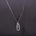 Detail of interlocking silver oval rings with micro-pave cubic zirconia on a cable chain - Platinum Silver 40+5cm