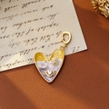 Vintage heart pendant with pearl and floral inlay on a classic brown leather background - Yellow and White Heart Floral Style