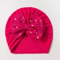 Detail of rose red baby turban with large bow and golden polka dots pattern - Rose Red