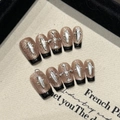 Handgefertigte Y2K Kunstnägel in Roségold-Glitzer mit schwarzen French Tips und 3D-Steinen - XS / Kurz Sarg