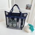 Dark blue mesh travel storage bag with handle and zipper for toiletries or cosmetics - Handbag Style / Navy Blue