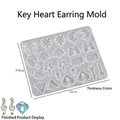 Silicone mold for resin earrings featuring heart and moon shapes with finished examples - Gold Heart Key