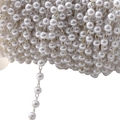 White pearl bead chain on a metal wire, ideal for DIY jewelry making and clothing crafts - Bright Silver