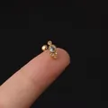 Minimalist 20G stainless steel stud with tiny gold cluster zircon held on fingertip - Round Cluster (347-2#G)