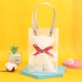 Close-up of white plush bear towel in a frosted gift bag with red 'Just for you' ribbon - 35x75cm (No Packaging) / White
