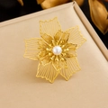 Close-up of gold hollow petal ring with a cream pearl center on textured fabric - Hollow Floral Style With Pearl (R557)