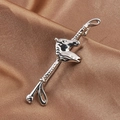 Silver horse head lapel pin on dark silk background with a focus on realistic texture - White K/Silver
