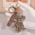 Handcrafted rhinestone bear keychain with colorful crystals and red studded leather strap - Colorful