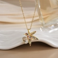 Macro shot of gold hummingbird pendant with colorful pavé stones and large clear crystal - FN0143 Multi-color Pave Oval Diamond Hummingbird